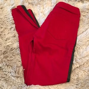 Red skinny jeans with leather piping
